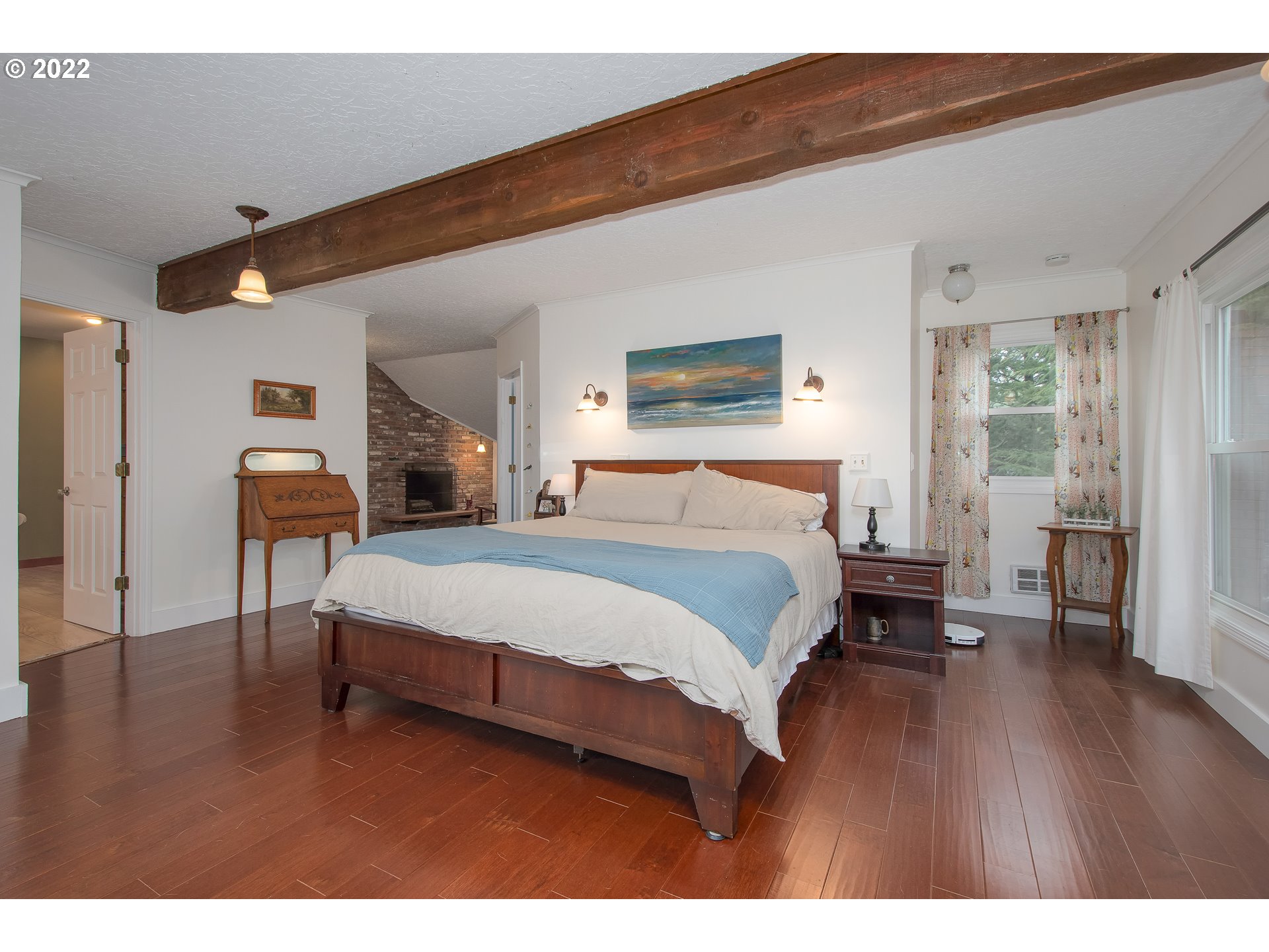 181 Marble Road Washougal, WA 98671 - Photo 21 of 32 a bedroom with a large bed a flat tv screen and dresser