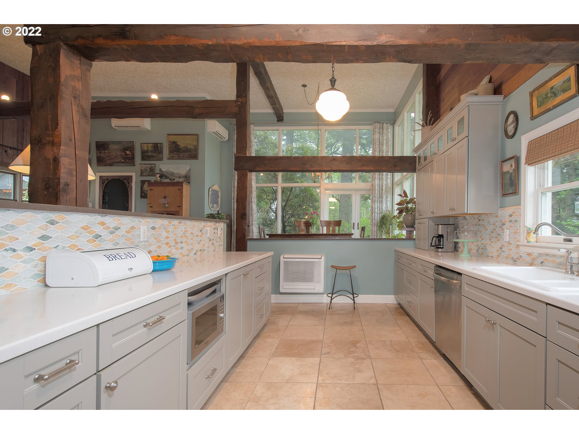 181 Marble Road Washougal, WA 98671 - Photo 10 of 32 a kitchen with a sink and wooden cabinets