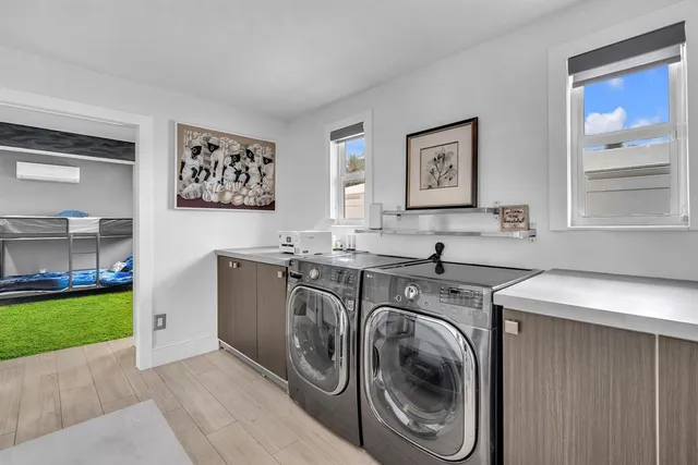 a view of a kitchen with washer and dryer