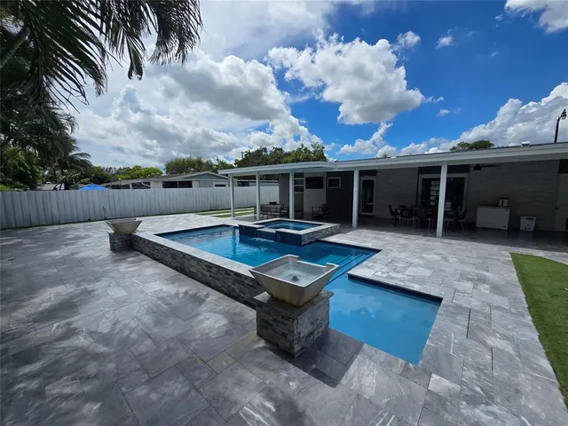 a view of a chairs and table in the patio