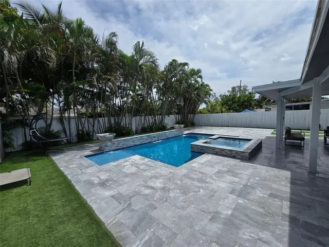 a view of a swimming pool with a patio