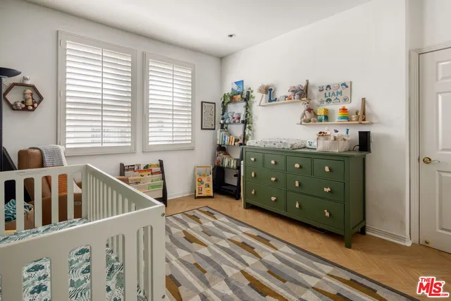 a bedroom with furniture and a window