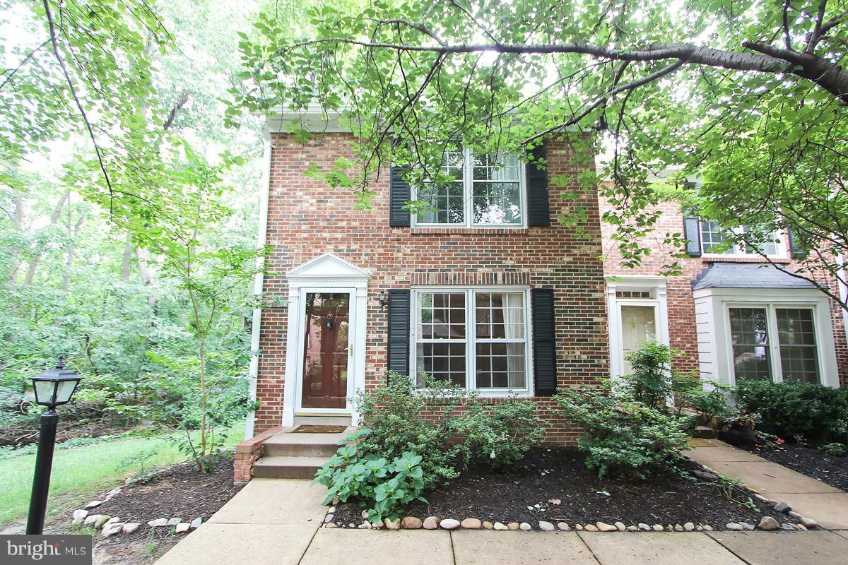 2428 South Walter Reed Drive, Unit A Arlington, VA 22206 - Photo 1 of 30 front view of a house with a yard