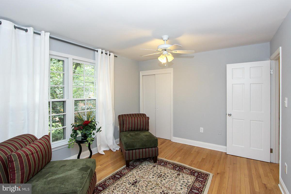 2428 South Walter Reed Drive, Unit A Arlington, VA 22206 - Photo 21 of 30 a living room with furniture flowerpot and wooden floor