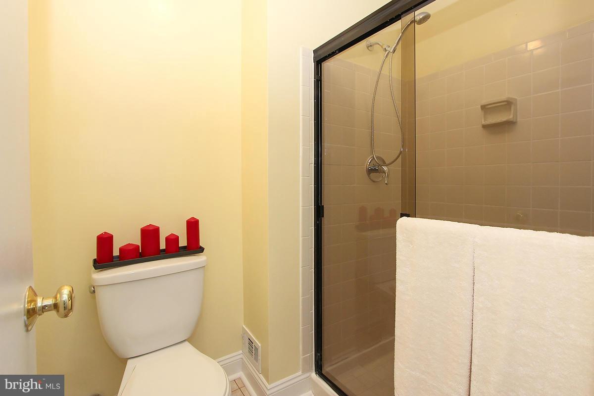 2428 South Walter Reed Drive, Unit A Arlington, VA 22206 - Photo 23 of 30 a bathroom with a toilet and a shower