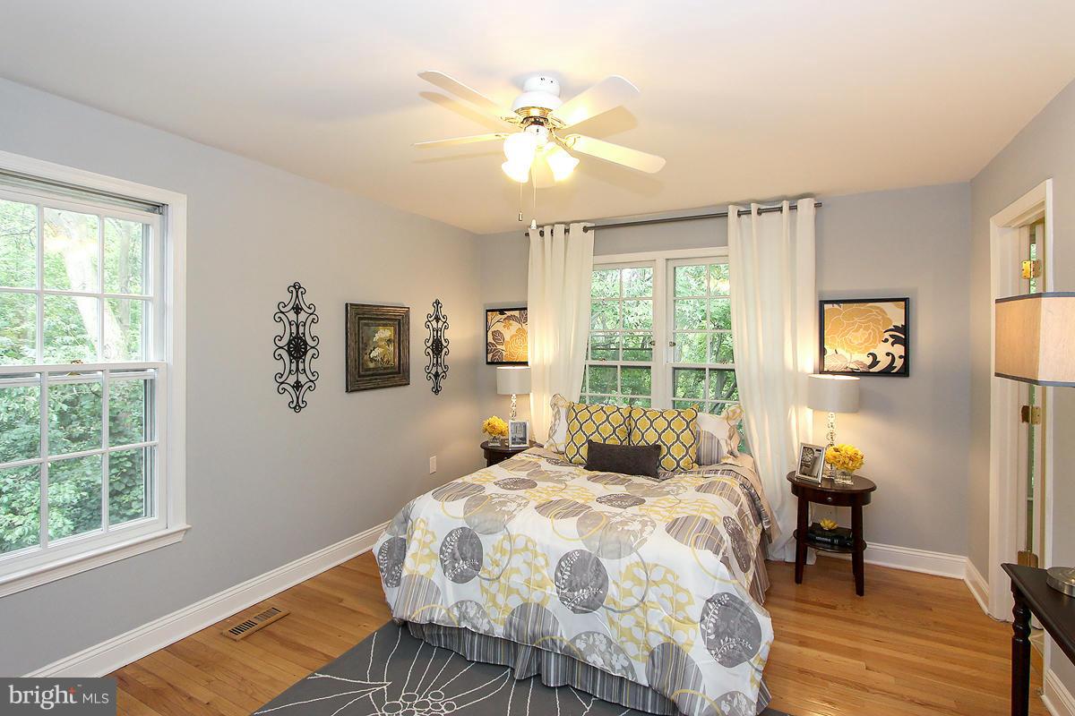 2428 South Walter Reed Drive, Unit A Arlington, VA 22206 - Photo 24 of 30 a bedroom with a bed and a window
