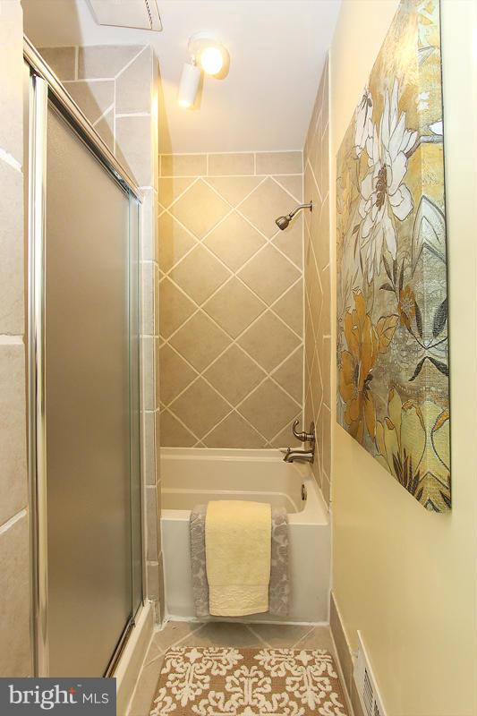 2428 South Walter Reed Drive, Unit A Arlington, VA 22206 - Photo 28 of 30 a bathroom with a shower