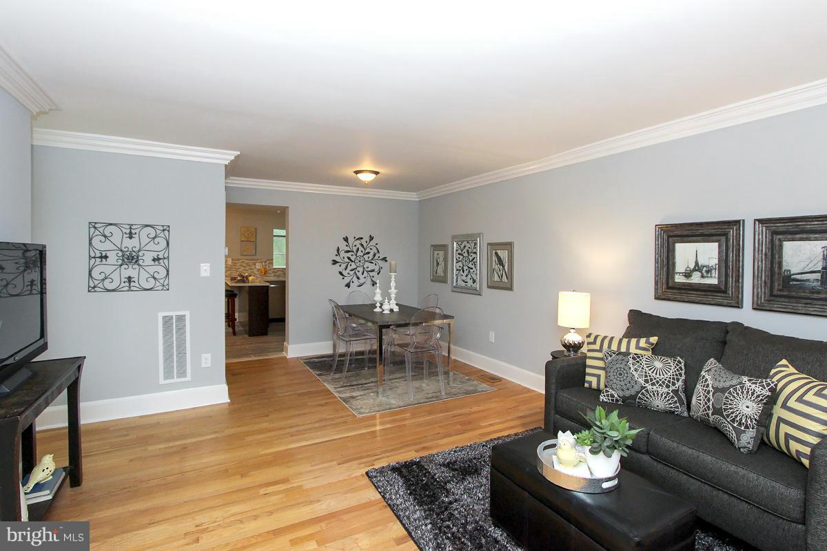 2428 South Walter Reed Drive, Unit A Arlington, VA 22206 - Photo 4 of 30 a living room with furniture and a wooden floor