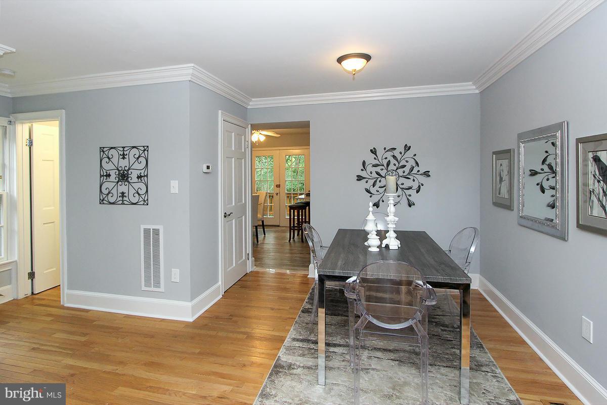 2428 South Walter Reed Drive, Unit A Arlington, VA 22206 - Photo 8 of 30 a living room with furniture and wooden floor