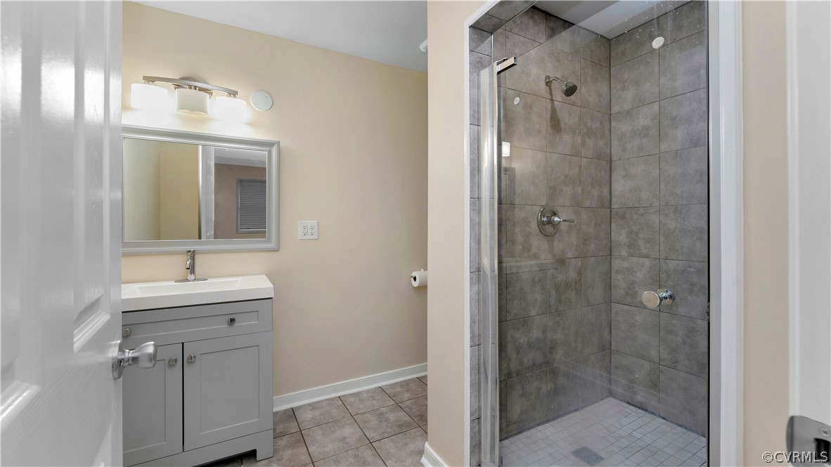 6212 Barrister Road Chesterfield, VA 23832 - Photo 18 of 19 a bathroom with a shower sink and mirror