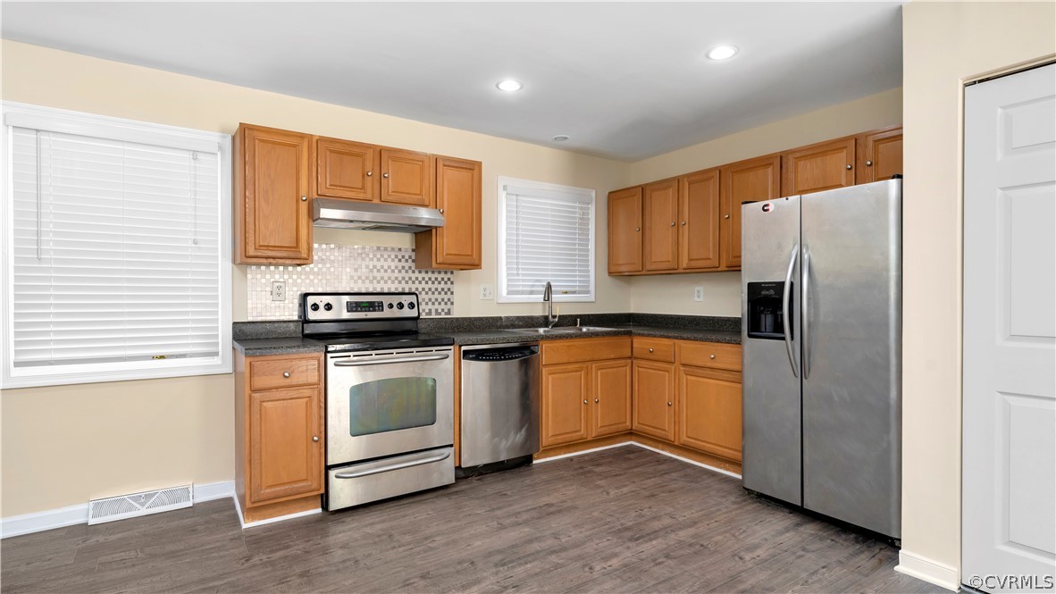 6212 Barrister Road Chesterfield, VA 23832 - Photo 3 of 19 a kitchen with granite countertop white cabinets and stainless steel appliances
