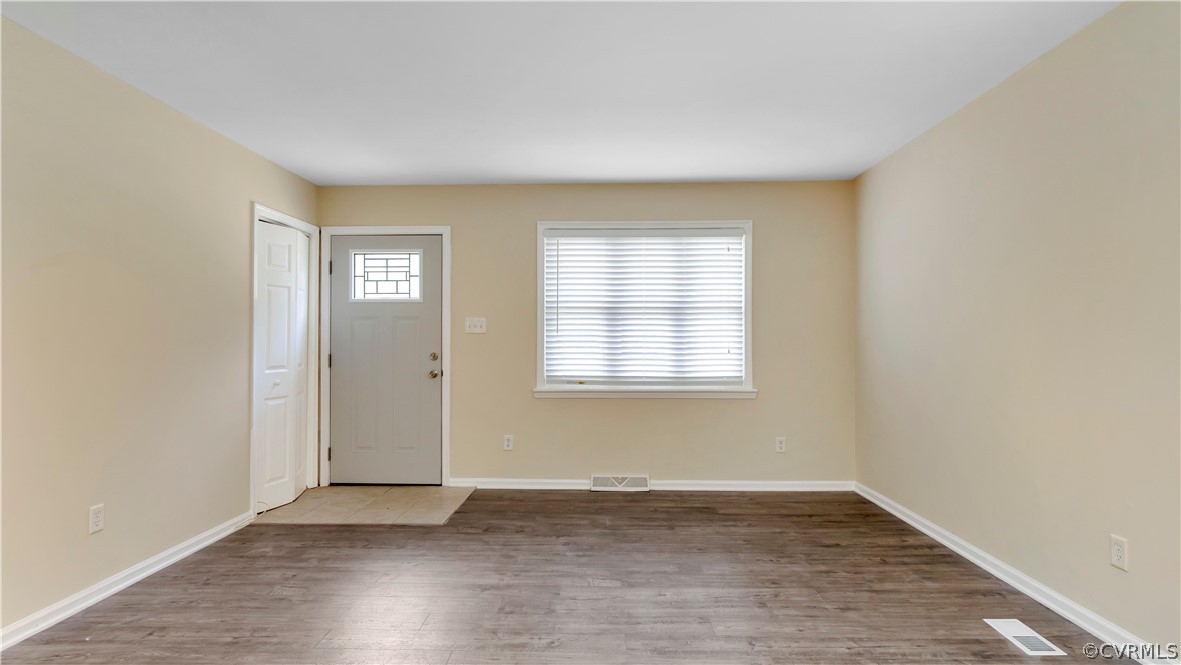 6212 Barrister Road Chesterfield, VA 23832 - Photo 5 of 19 an empty room with wooden floor and windows