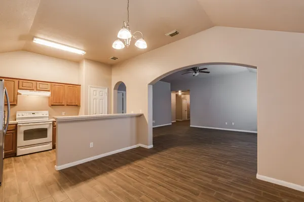 a view of a kitchen with a sink and a stove top oven