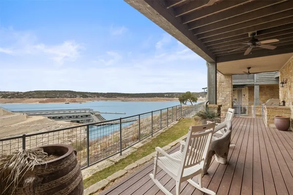 a view of a balcony with ocean view and ocean view