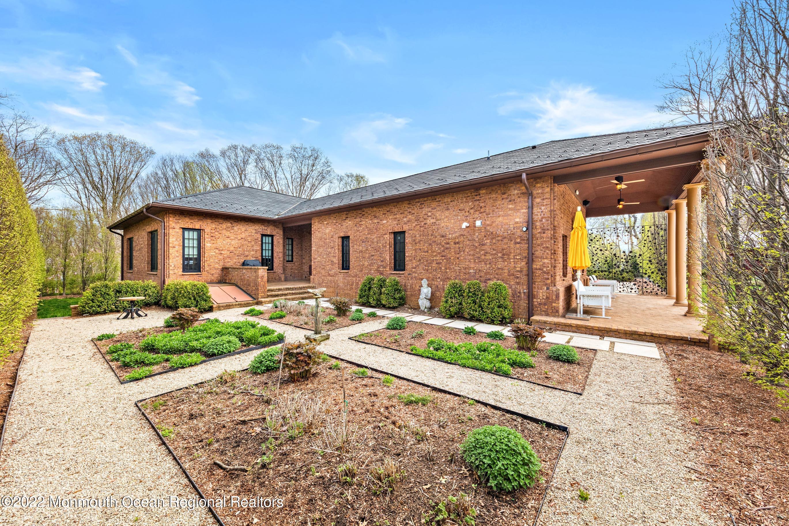 8 Edgewood Road Rumson, NJ 07760 - Photo 27 of 31 a front view of house with yard and green space