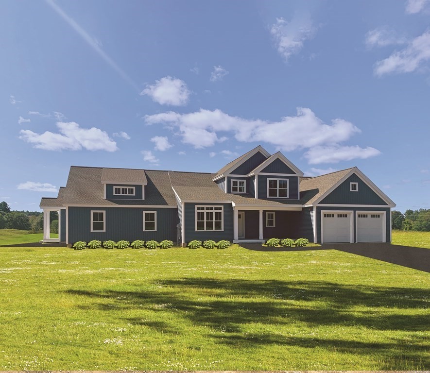 a view of a big house with a large pool and a yard in front of the house