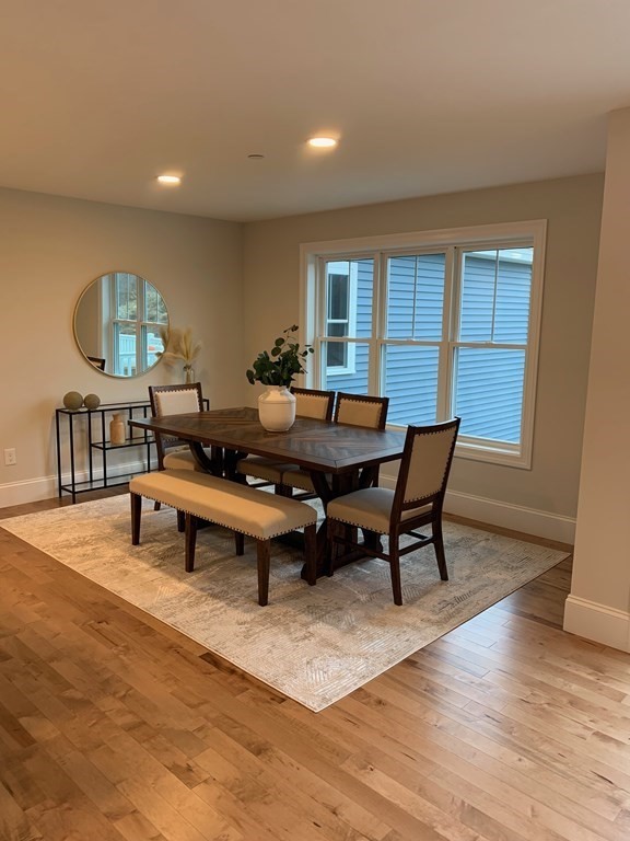 4 Putnam Road Hudson, NH 03051 - Photo 3 of 11 a view of a dining room with furniture and wooden floor