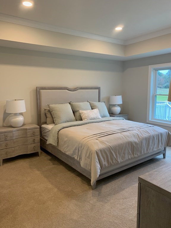 4 Putnam Road Hudson, NH 03051 - Photo 6 of 11 a bedroom with a bed and a couch