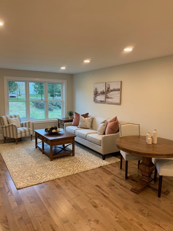 4 Putnam Road Hudson, NH 03051 - Photo 9 of 11 a living room with furniture and a large window