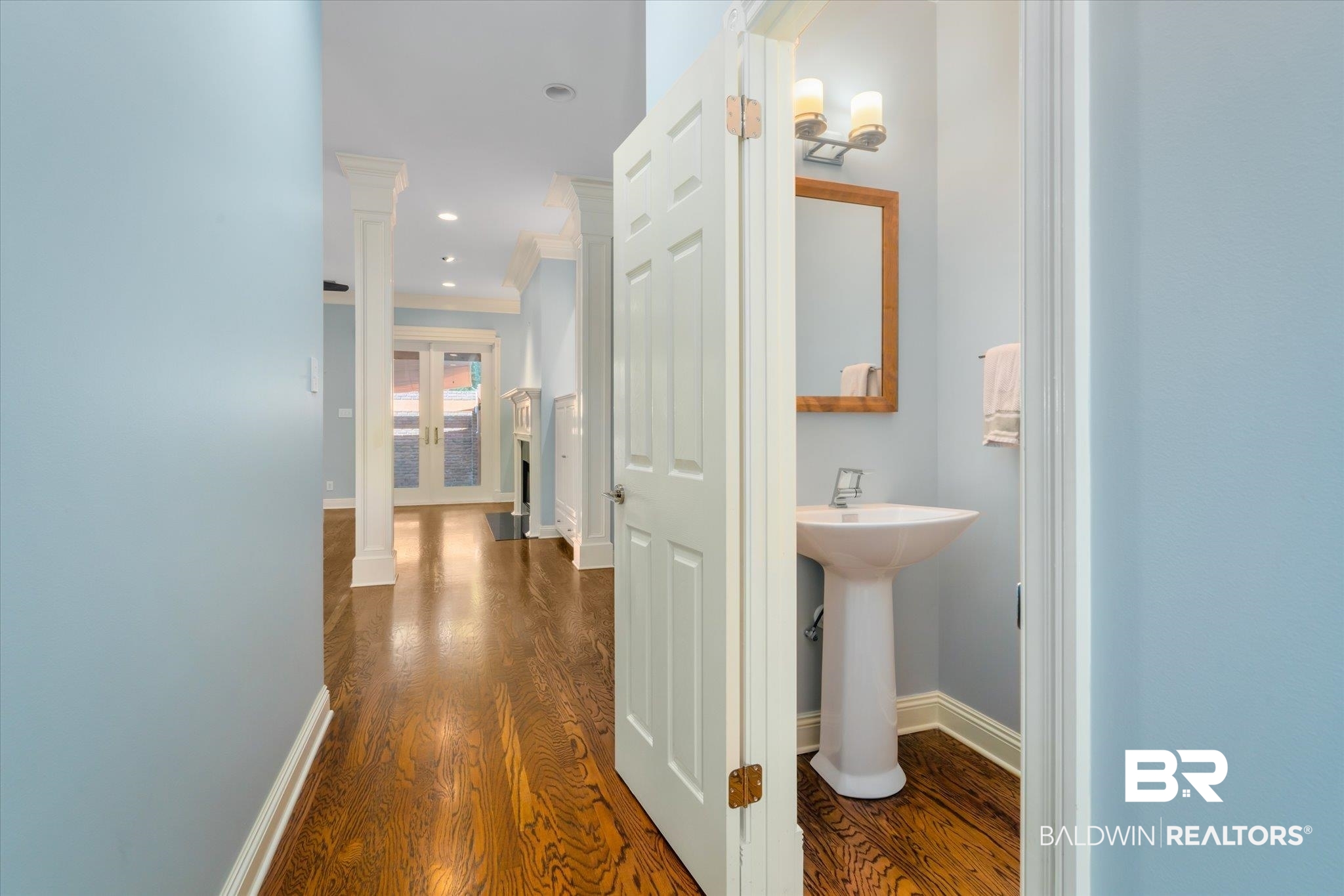 107 Fielding Place Mobile, AL 36608 - Photo 8 of 27 Hall featuring dark wood-style floors, crown molding, baseboards, recessed lighting, and a sink