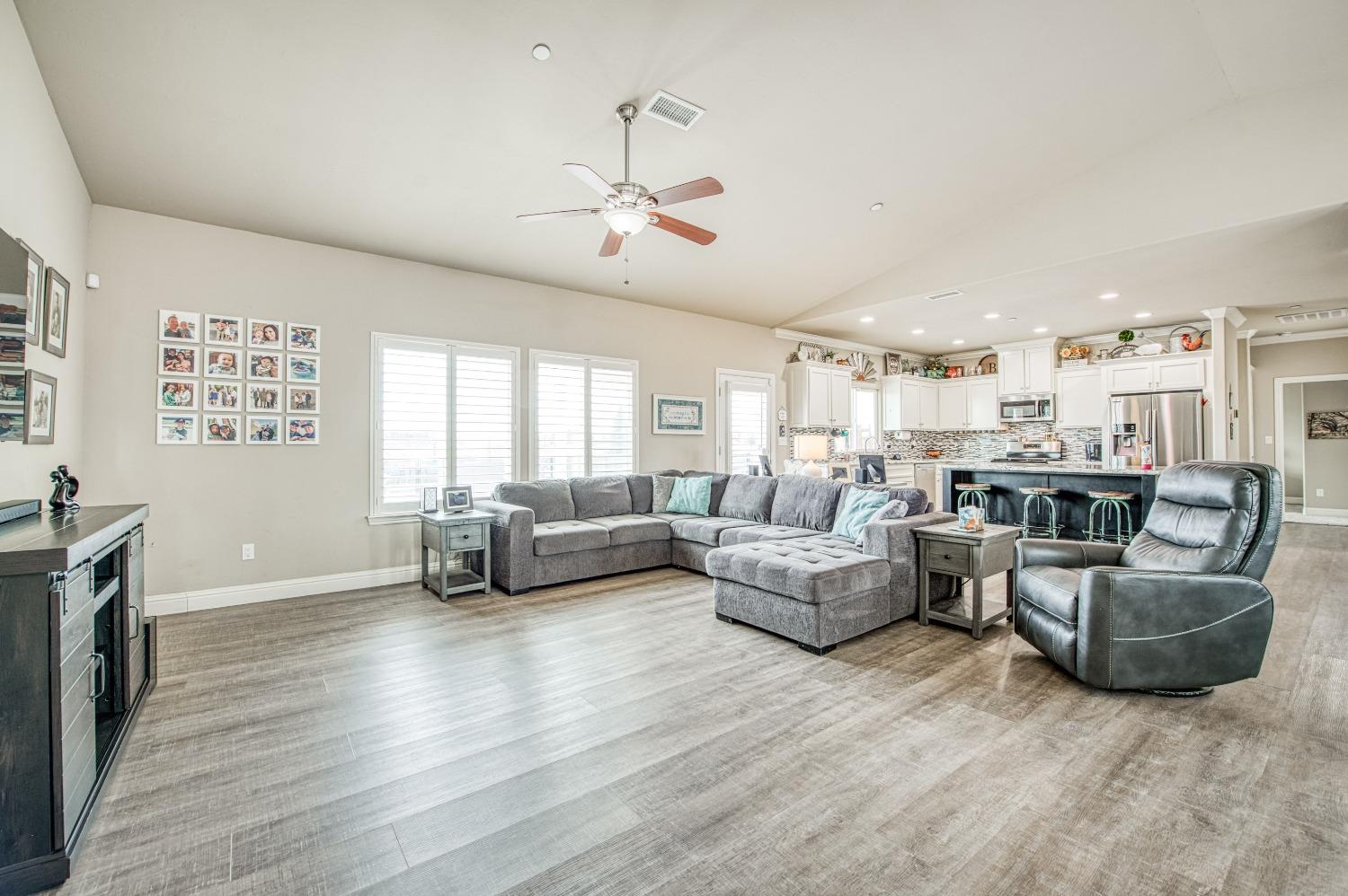 36919 Ave 17 1/2 Madera, CA 93636 - Photo 11 of 77 a living room with furniture and a fireplace