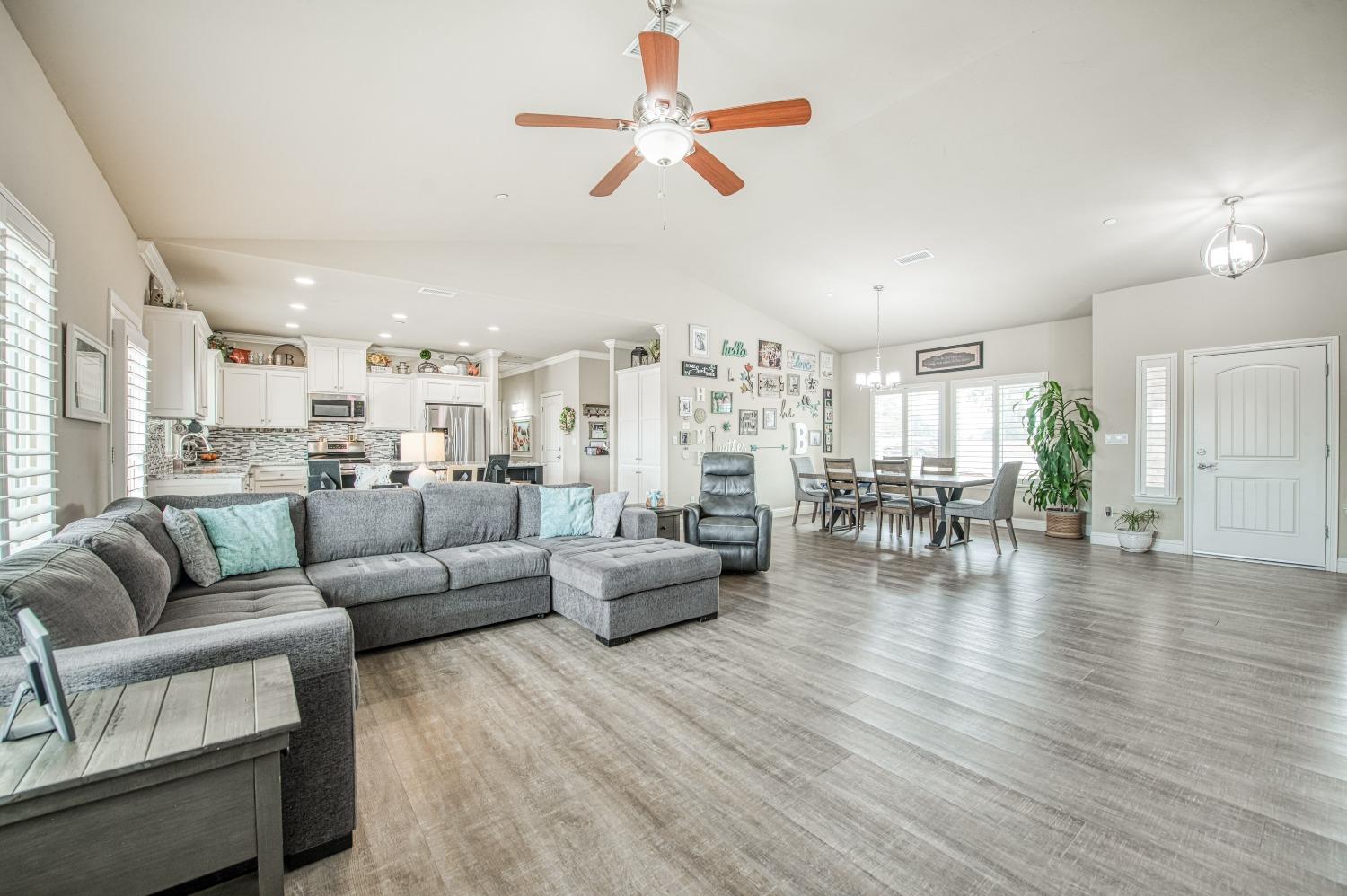 36919 Ave 17 1/2 Madera, CA 93636 - Photo 12 of 77 a living room with furniture or kitchen view and a wooden floor