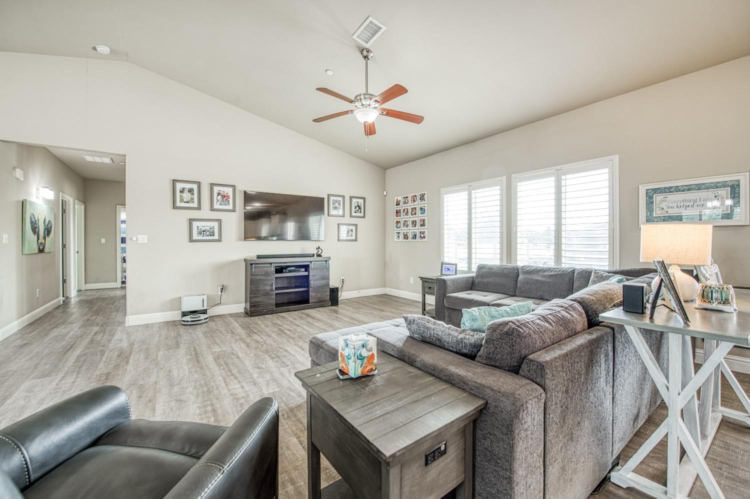 36919 Ave 17 1/2 Madera, CA 93636 - Photo 13 of 77 a living room with furniture and a fireplace