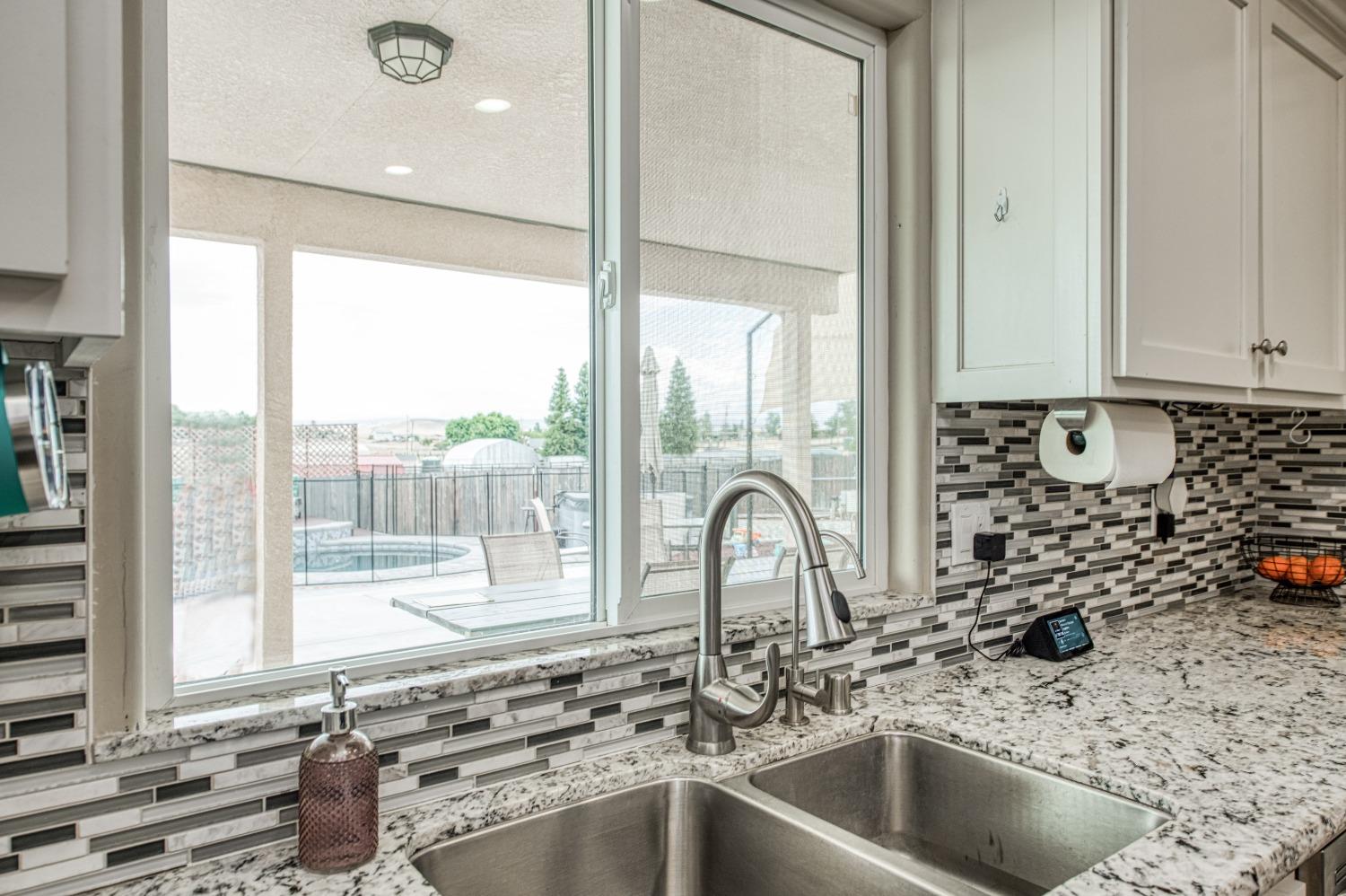 36919 Ave 17 1/2 Madera, CA 93636 - Photo 18 of 77 a kitchen with a sink and a window