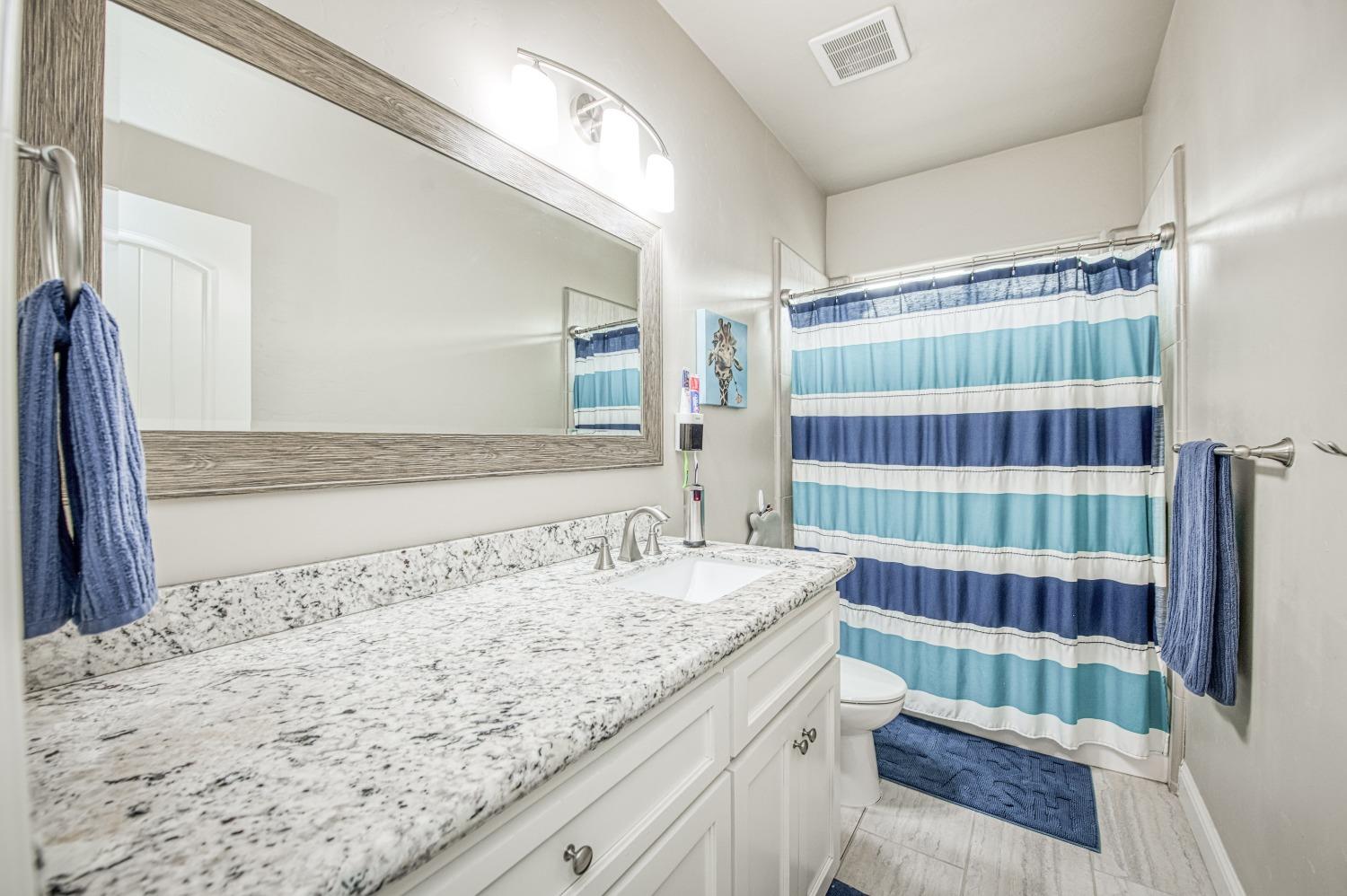 36919 Ave 17 1/2 Madera, CA 93636 - Photo 29 of 77 a bathroom with a sink and a shower