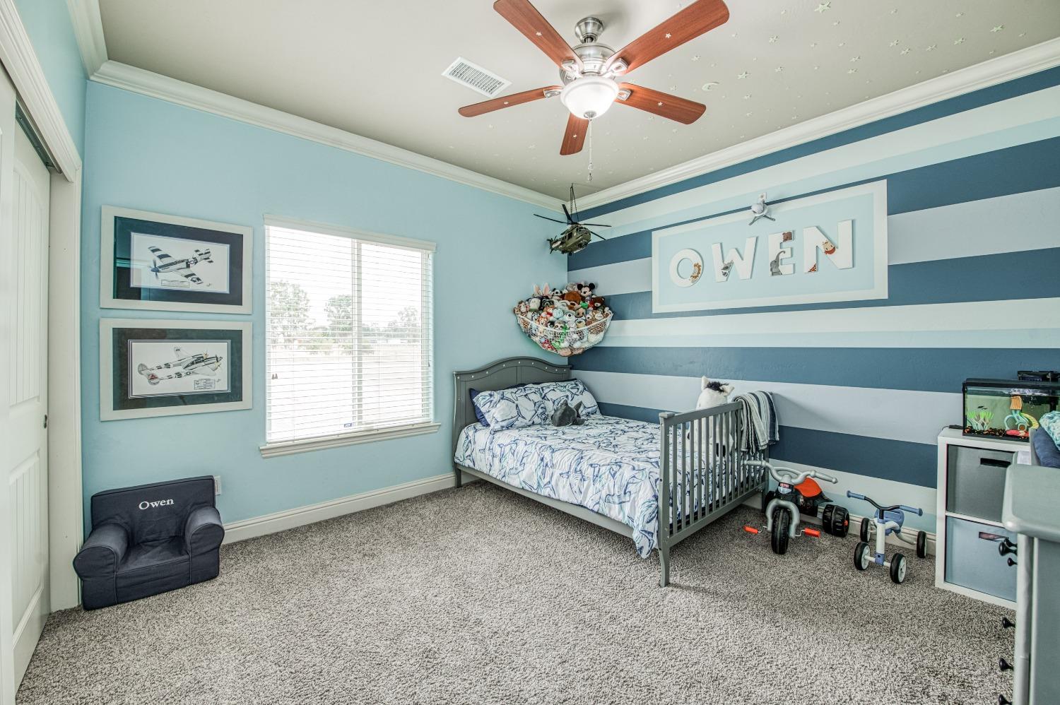 36919 Ave 17 1/2 Madera, CA 93636 - Photo 30 of 77 a bedroom with a bed and a chandelier