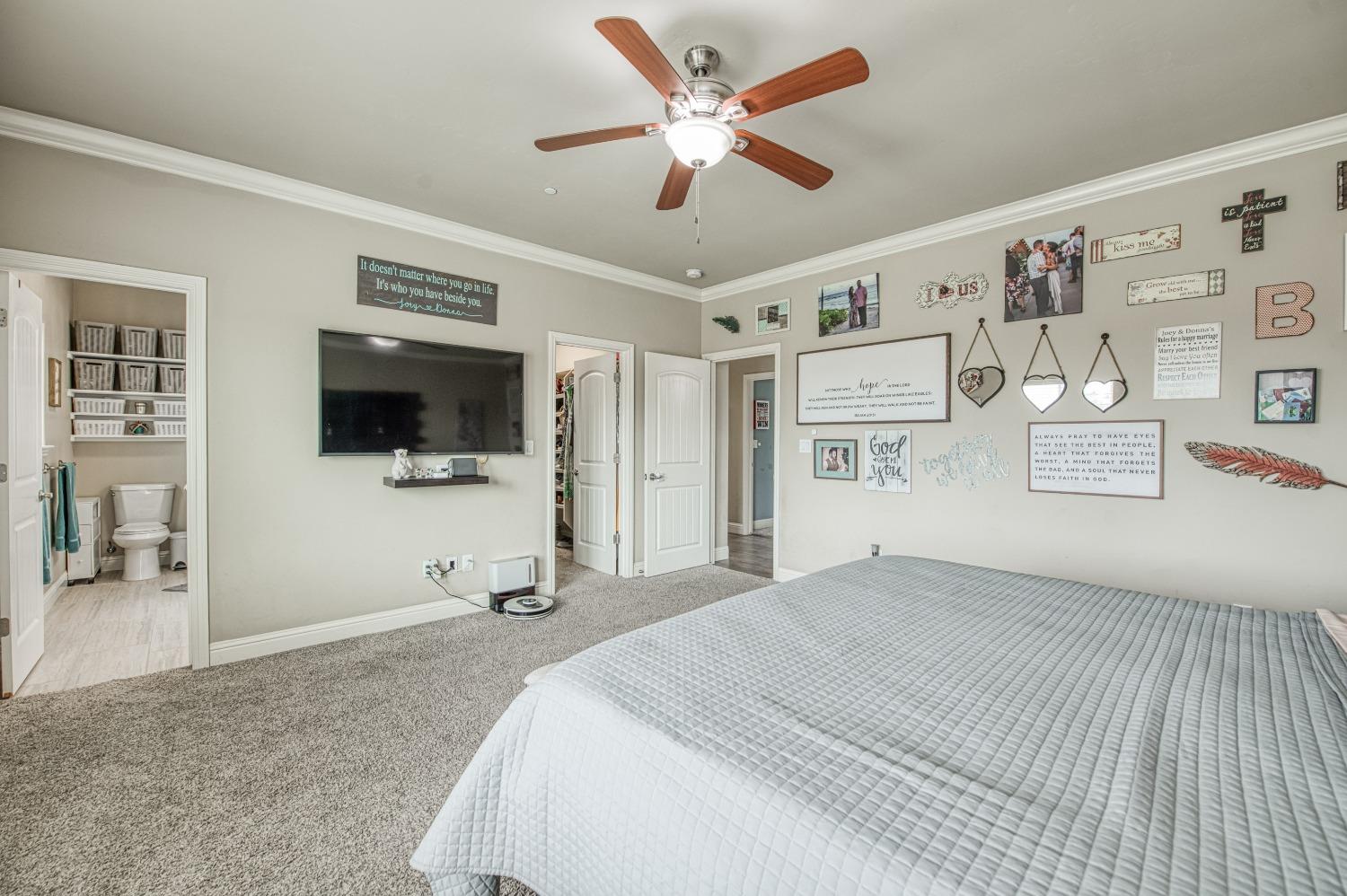 36919 Ave 17 1/2 Madera, CA 93636 - Photo 33 of 77 a bedroom with a bed and a flat screen tv