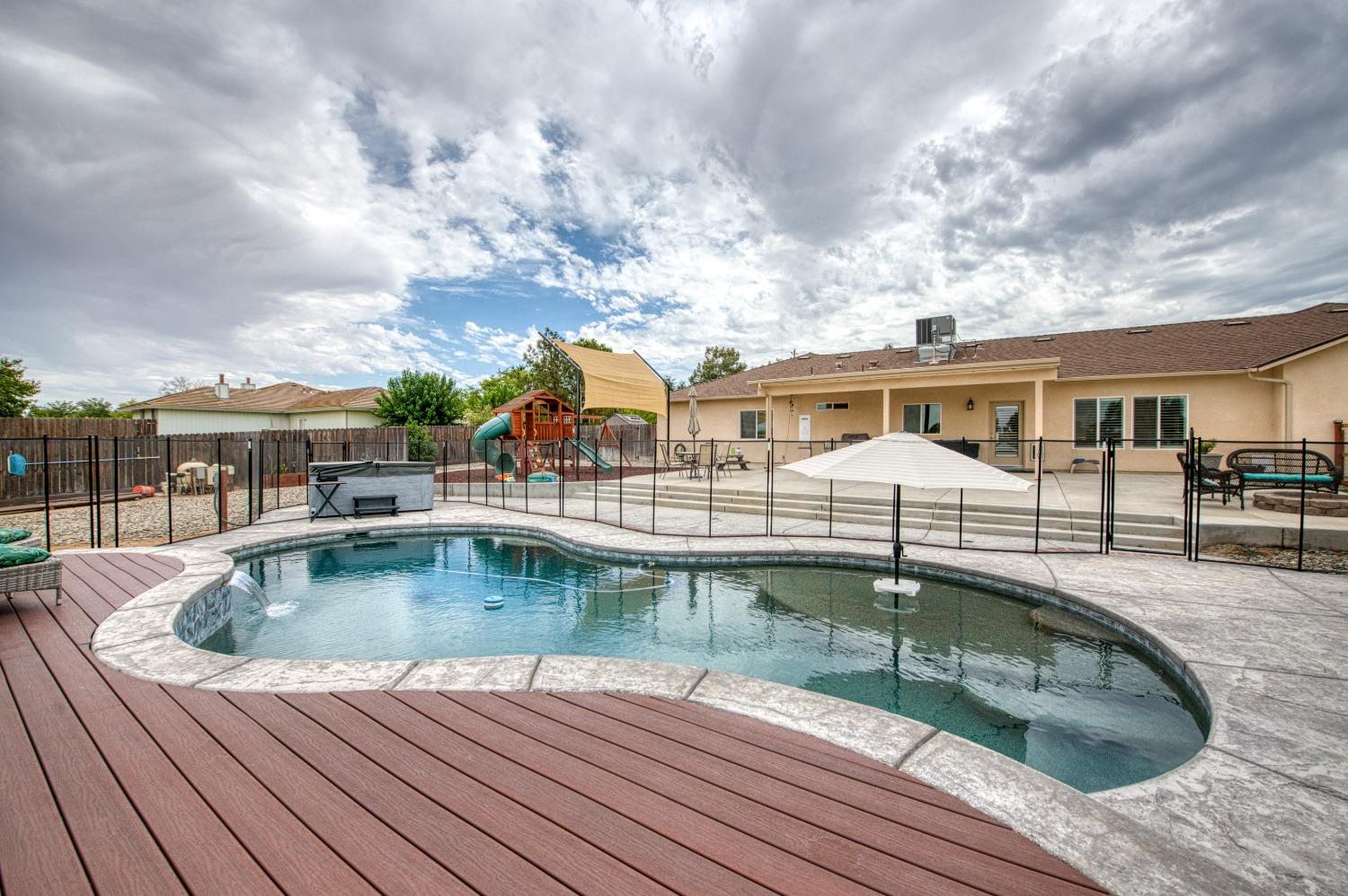 36919 Ave 17 1/2 Madera, CA 93636 - Photo 38 of 77 a view of backyard with swimming pool and seating