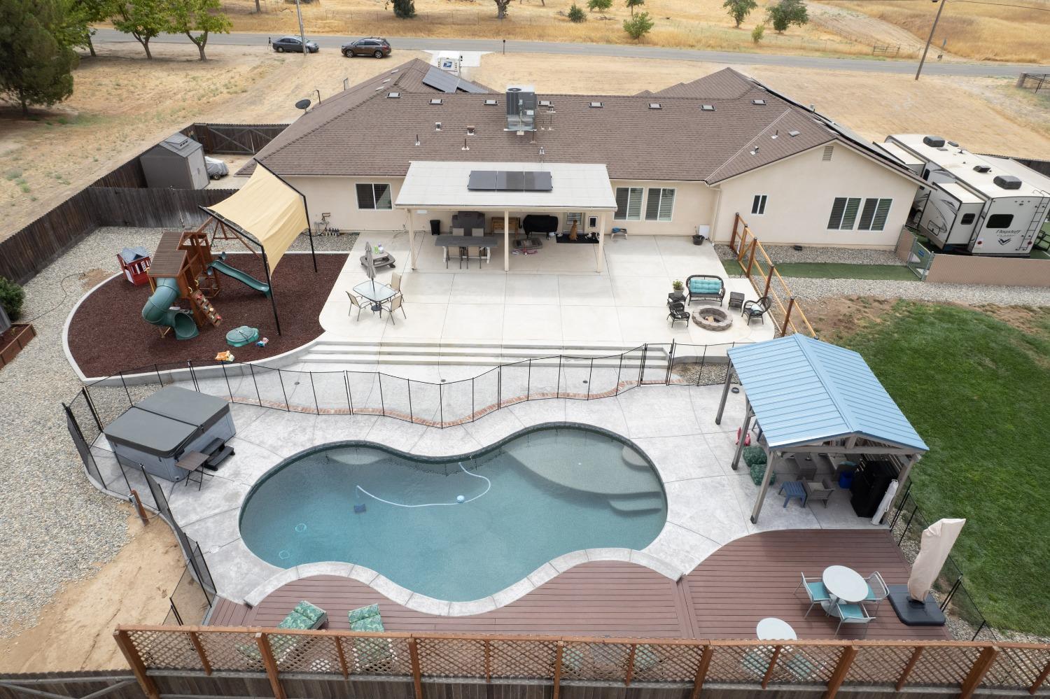 36919 Ave 17 1/2 Madera, CA 93636 - Photo 4 of 77 an aerial view of a house with swimming pool and patio