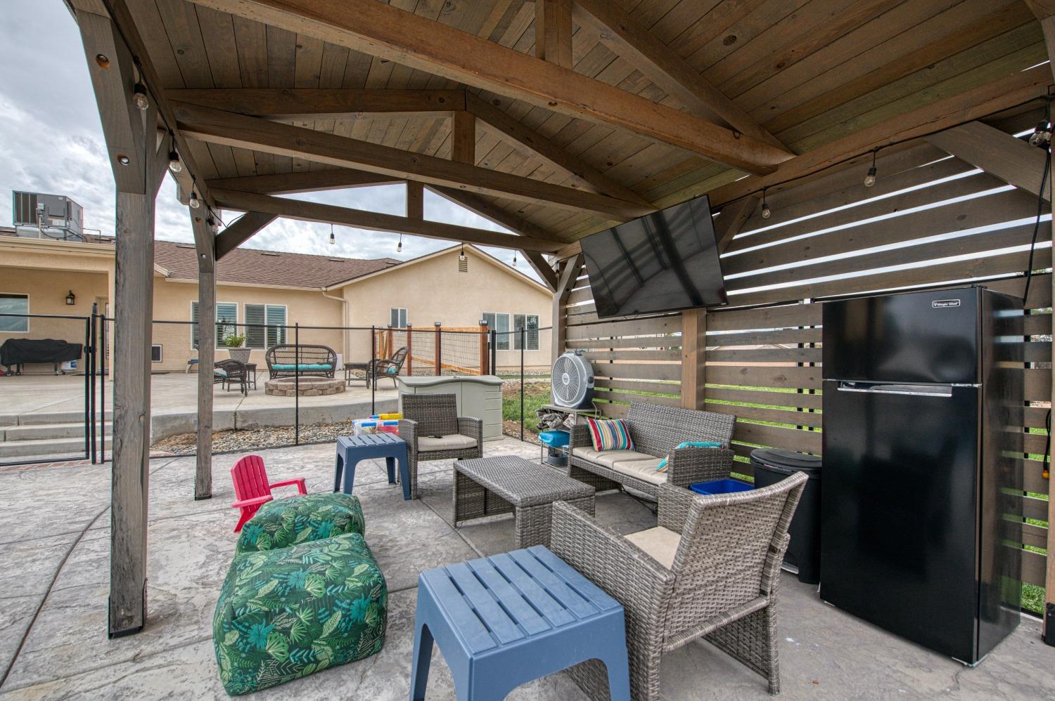 36919 Ave 17 1/2 Madera, CA 93636 - Photo 41 of 77 a living room with patio furniture and a potted plant