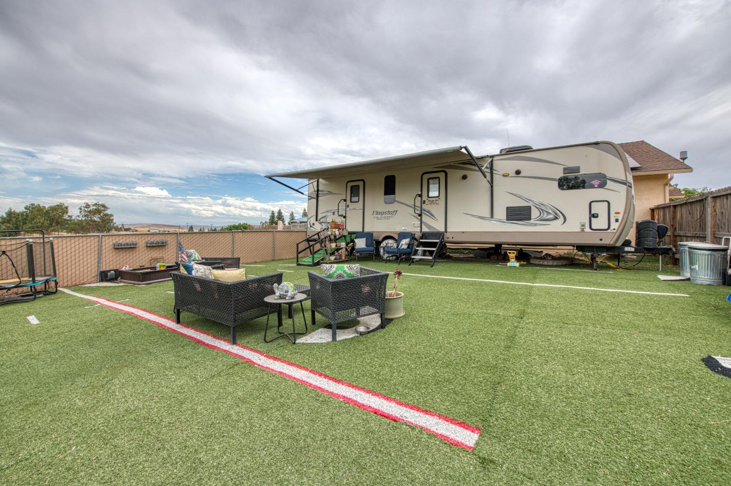36919 Ave 17 1/2 Madera, CA 93636 - Photo 56 of 77 a backyard of a house with table and chairs