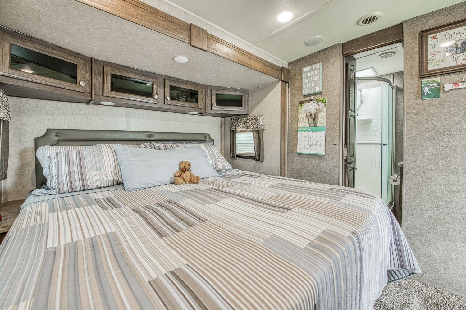 36919 Ave 17 1/2 Madera, CA 93636 - Photo 57 of 77 a bedroom with a large bed and a large window