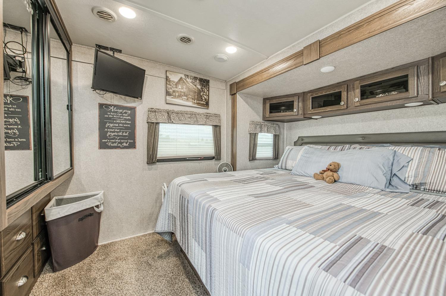 36919 Ave 17 1/2 Madera, CA 93636 - Photo 58 of 77 a bedroom with a bed and a television