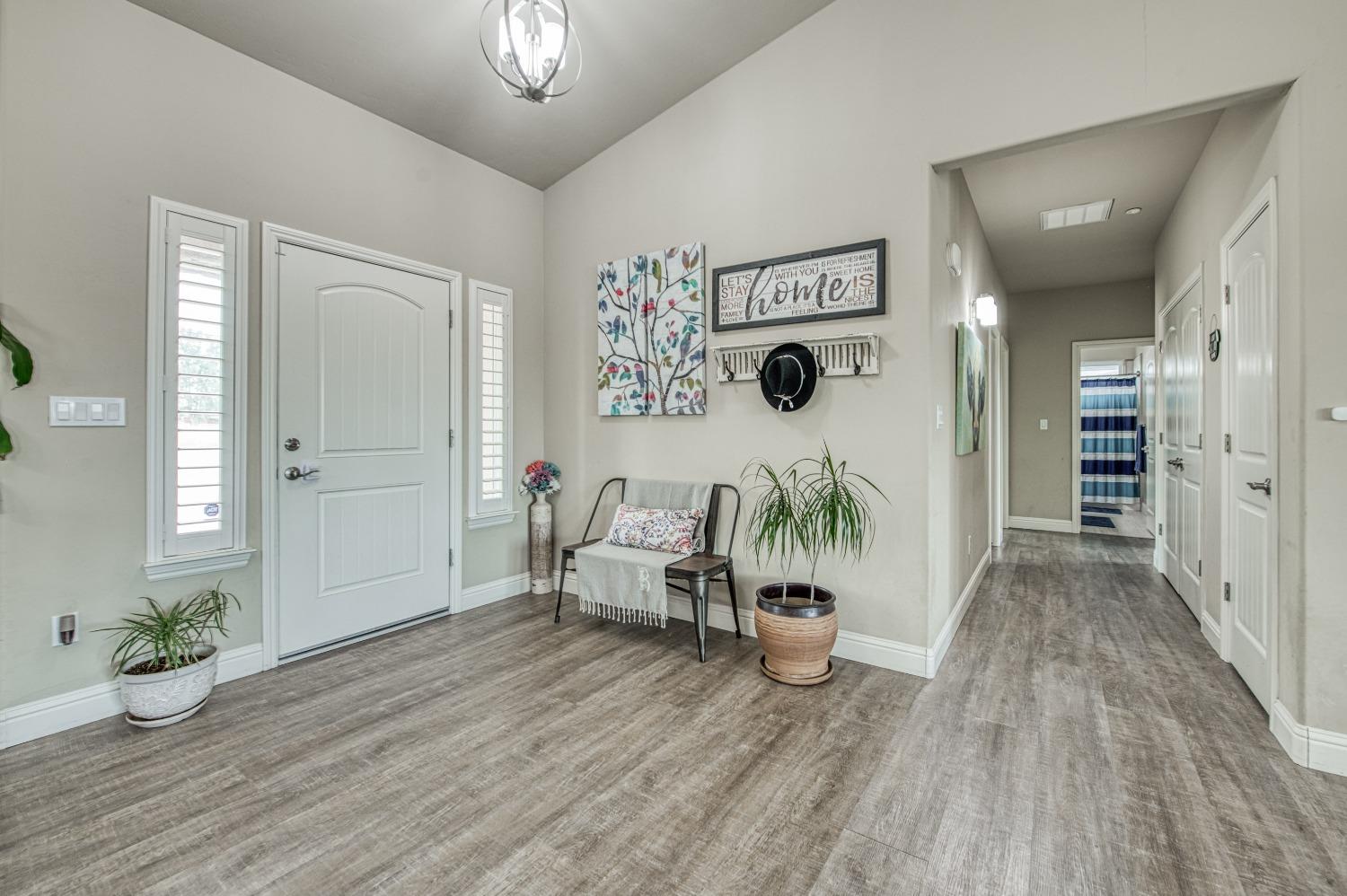 36919 Ave 17 1/2 Madera, CA 93636 - Photo 7 of 77 a living room with furniture and wooden floor
