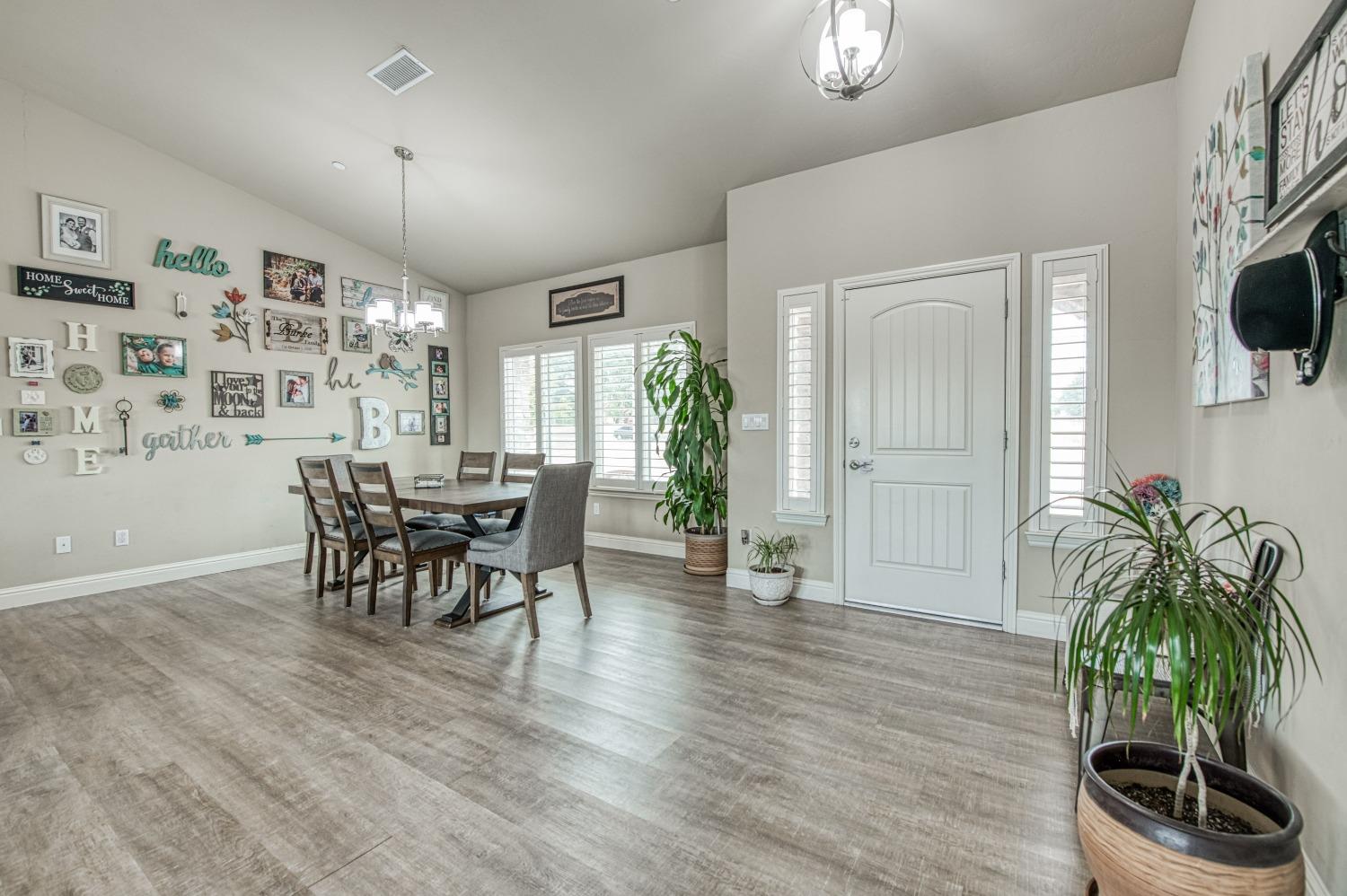 36919 Ave 17 1/2 Madera, CA 93636 - Photo 8 of 77 a dining room with furniture and wooden floor