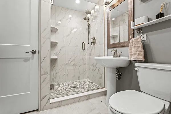a view of a kitchen with countertop cabinets and white appliances