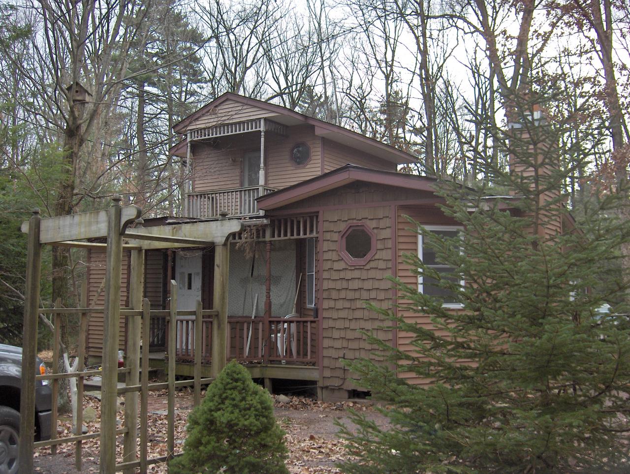 1342 Kroucher Road Stroudsburg, PA 18360 - Photo 1 of 8 a front view of a house with plants