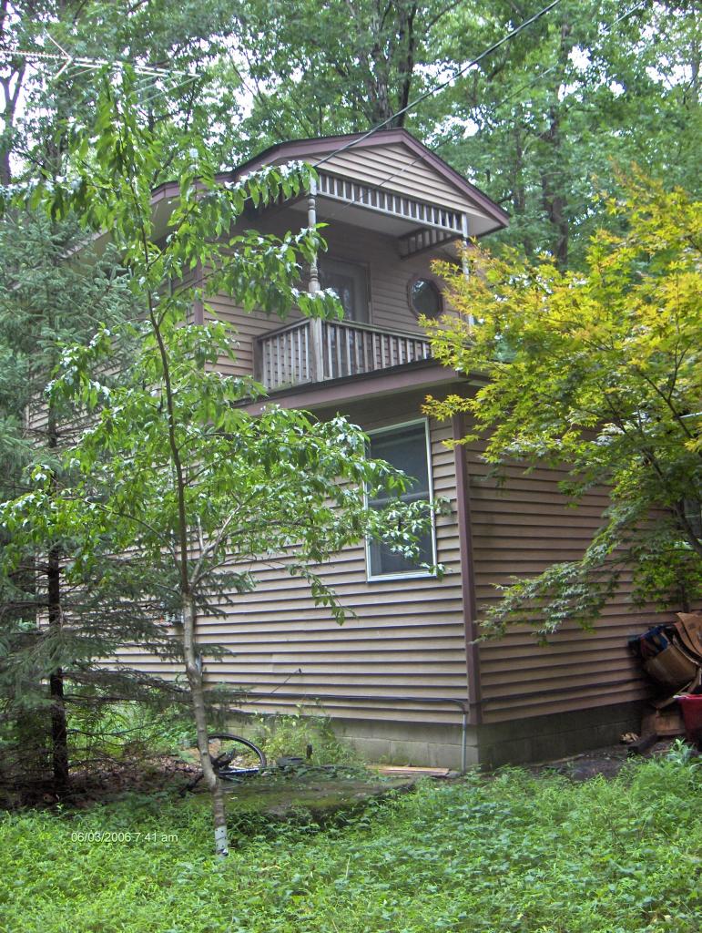 1342 Kroucher Road Stroudsburg, PA 18360 - Photo 5 of 8 a view of a house with a yard and plants