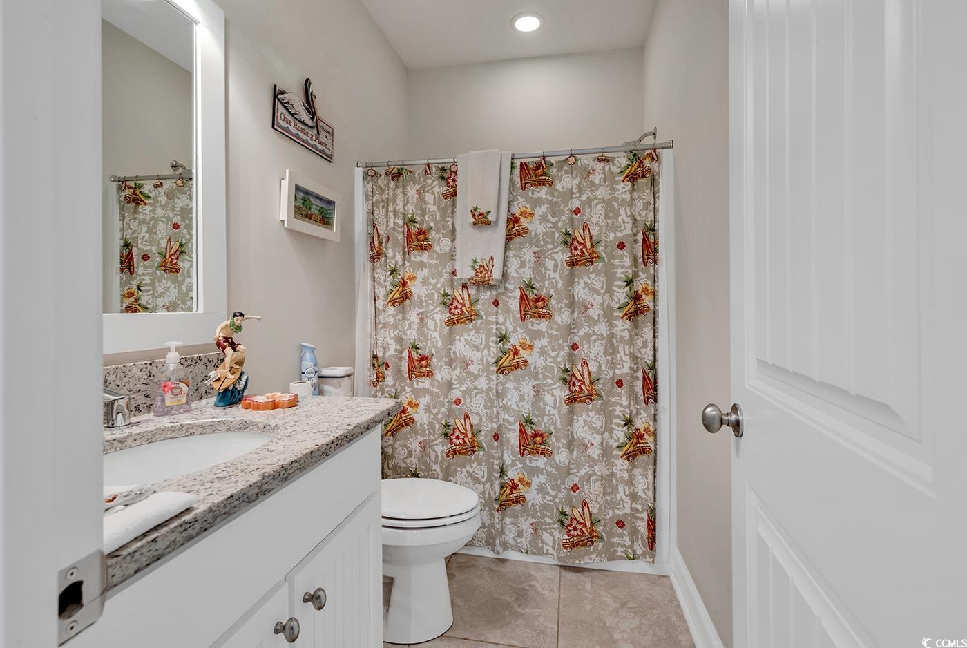 500 Percival Court Murrells Inlet, SC 29576 - Photo 21 of 40 Bathroom with tile flooring, large vanity, and toi