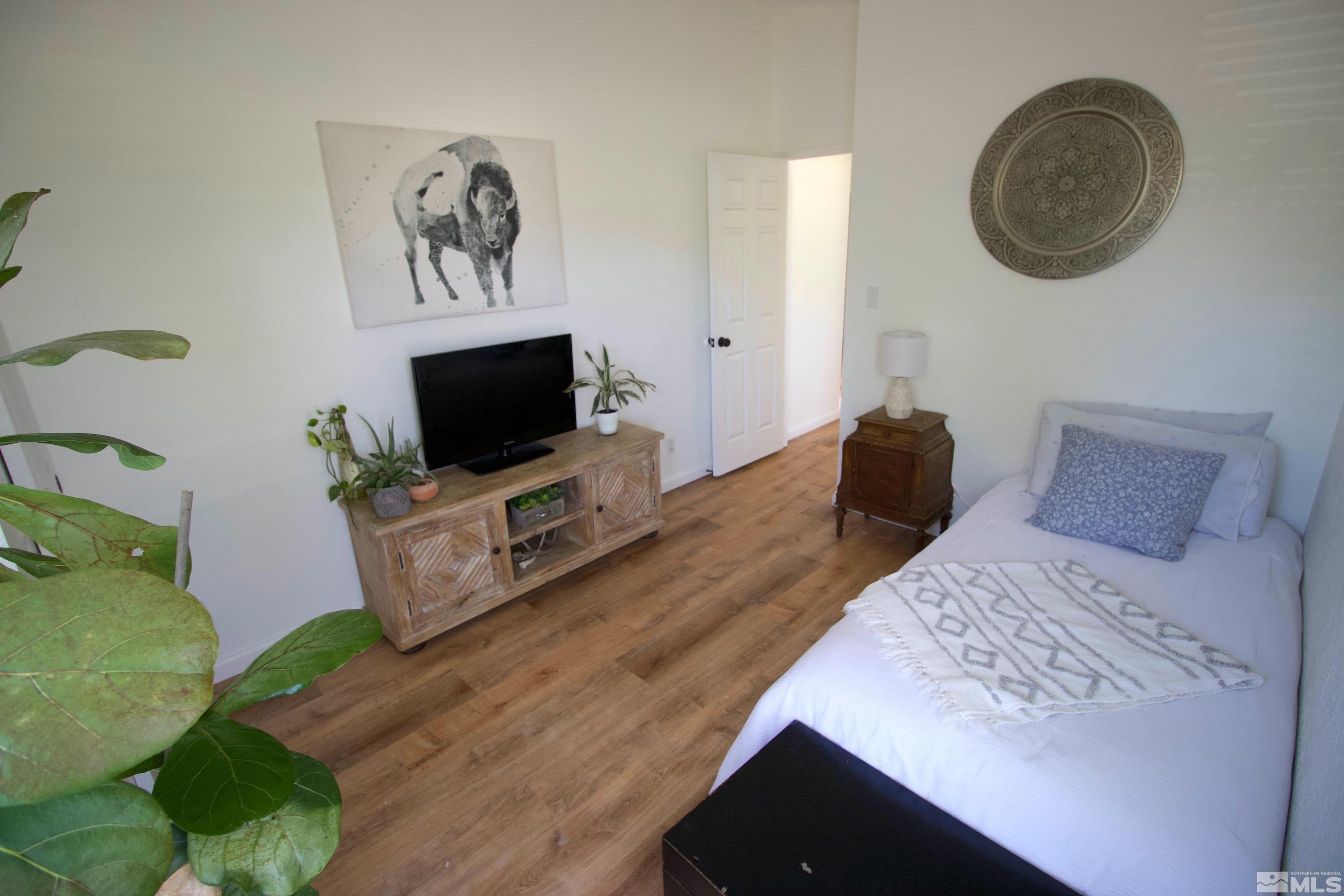 6350 Moon Ridge Terrace Reno, NV 89523 - Photo 17 of 19 a bedroom with a bed and a flat screen tv