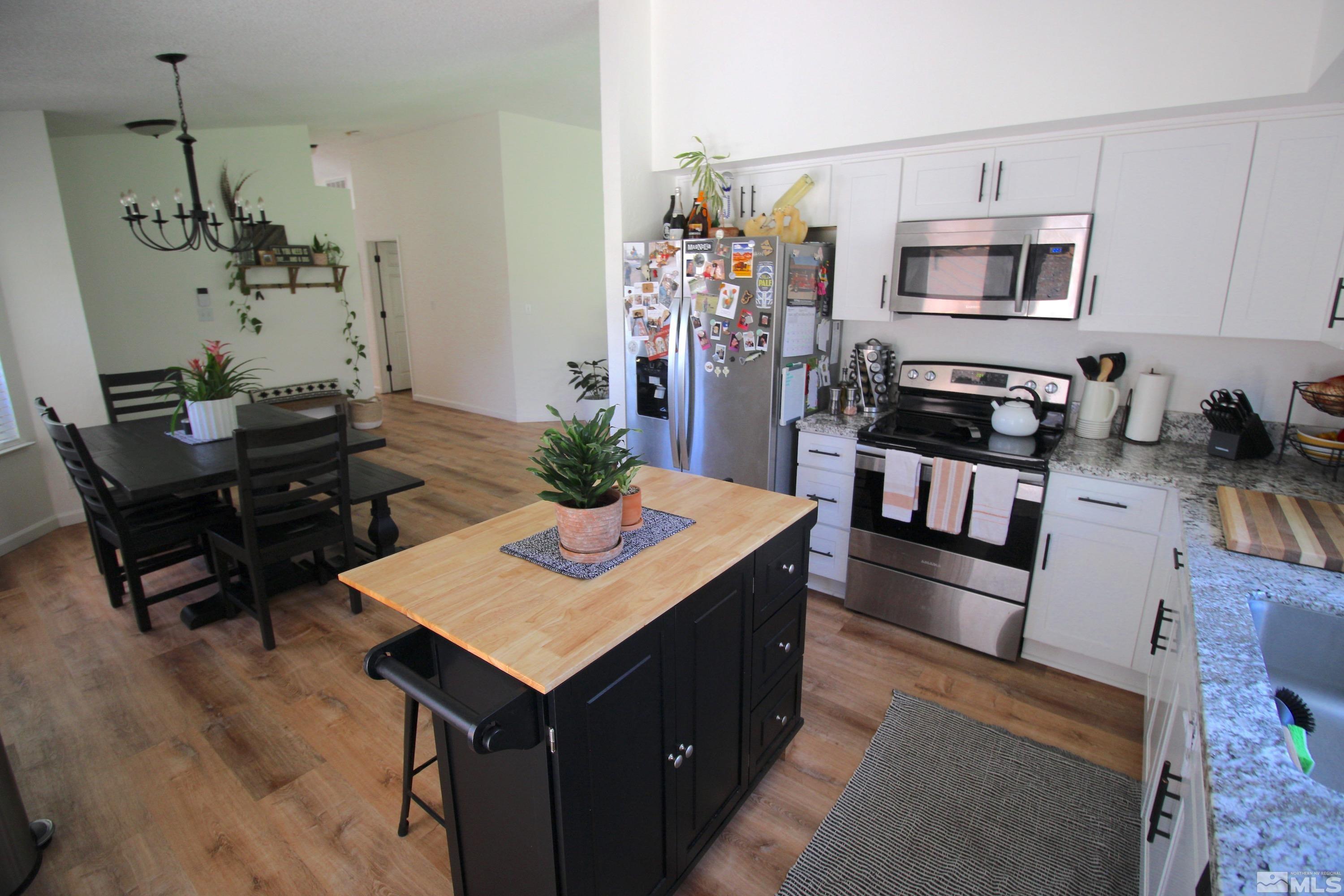 6350 Moon Ridge Terrace Reno, NV 89523 - Photo 9 of 19 a kitchen with a stove refrigerator and microwave