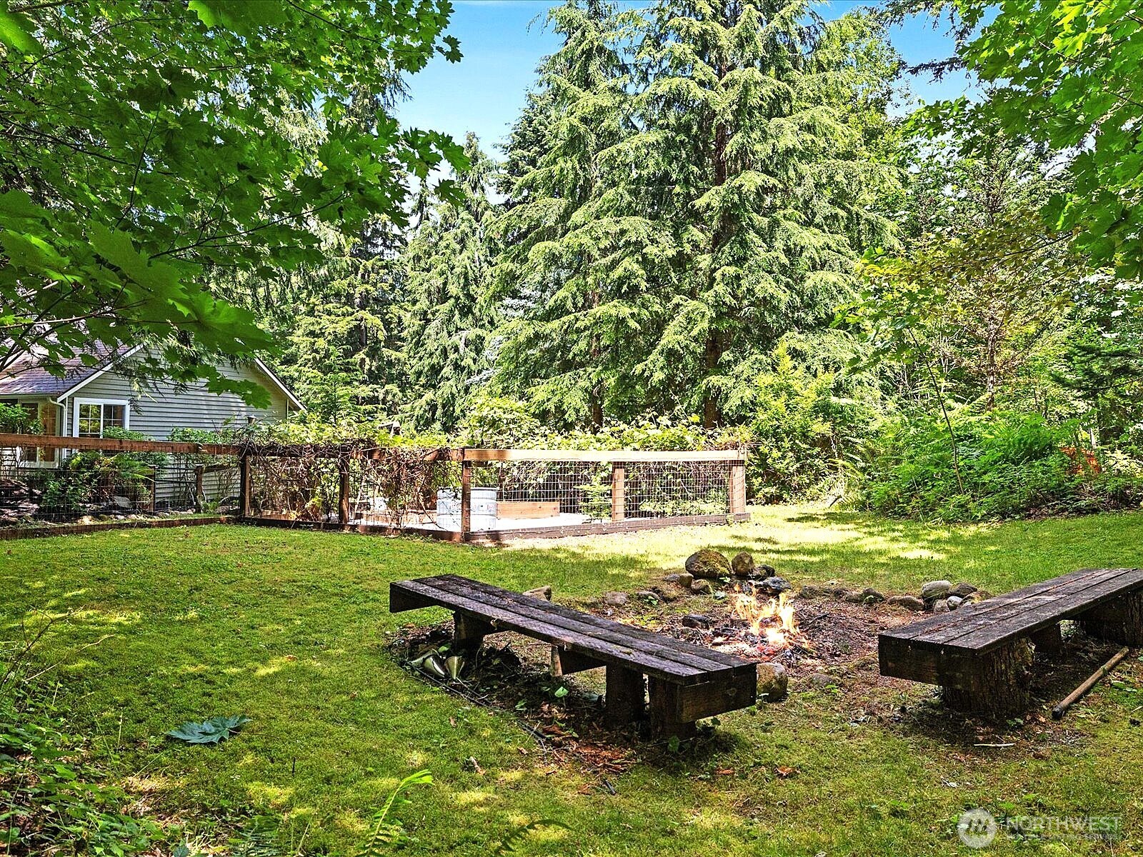 33606 Northeast Lake Joy Road Carnation, WA 98014 - Photo 38 of 40 a view of a wooden deck and a yard