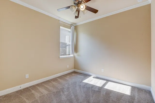 a view of a hallway with wooden floor and entryway