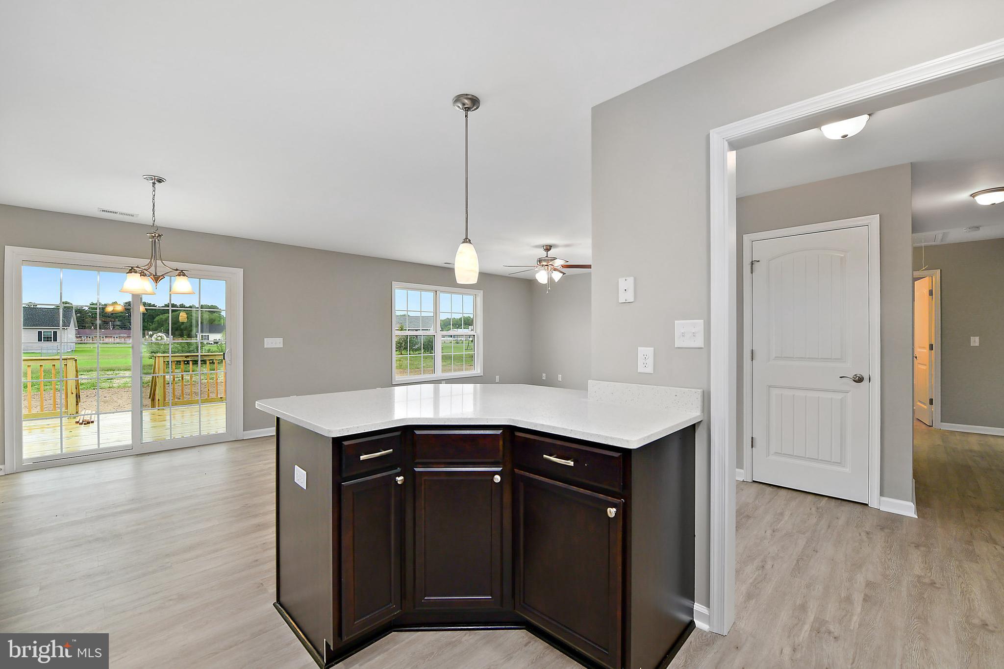 153 Fooks Road Bishopville, MD 21813 - Photo 12 of 30 a kitchen with a sink a counter space and wooden floor
