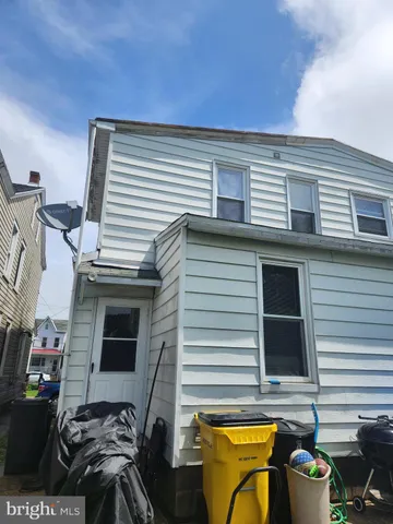 a view of a balcony with furniture and a flat screen tv