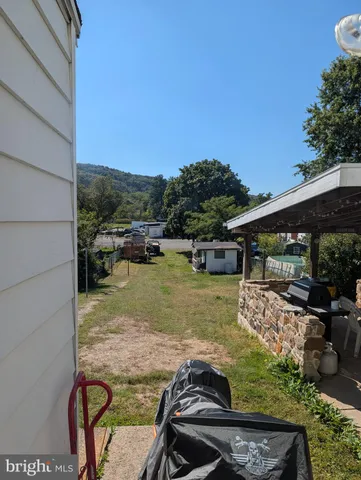 a view of swimming pool with a lounge chair